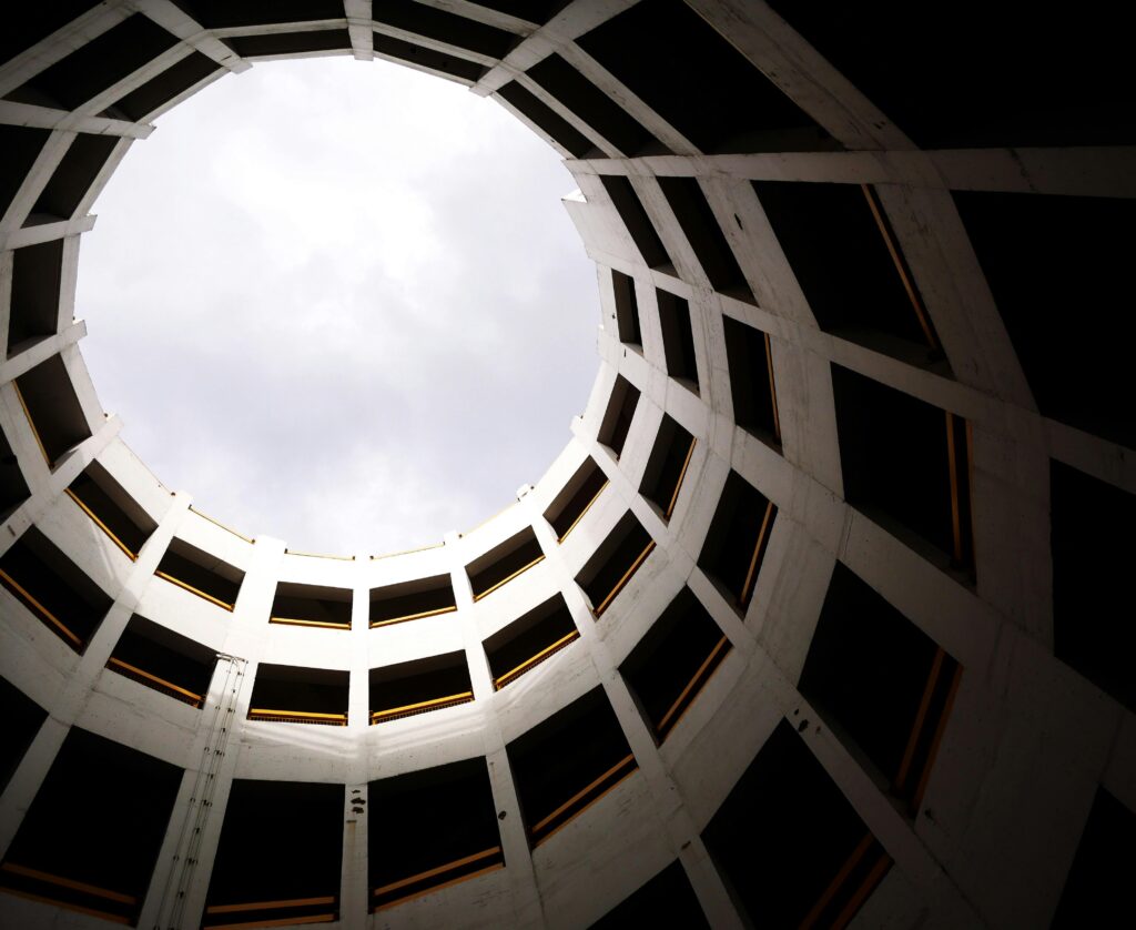 pexels-photo-2280151-2280151 Low angle shot of a circular modern building interior with skylight and geometric design.